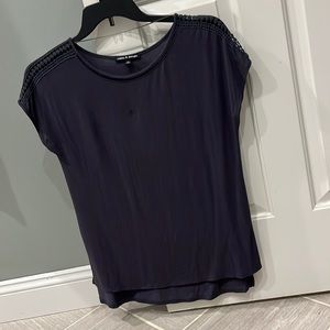 Gray blouse with decoration on shoulder and around neck